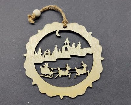 Laser Cut Snowy Town Scene with Santa Sleigh and Reindeers